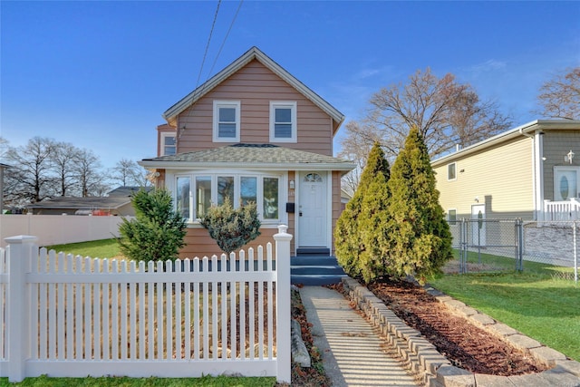 view of front of home with a front lawn