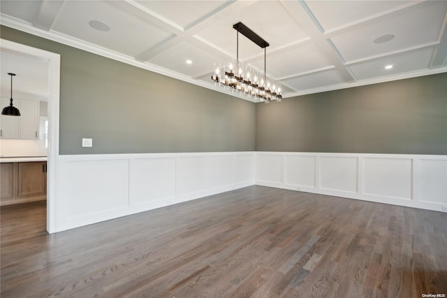 unfurnished room with a chandelier, wood-type flooring, and coffered ceiling