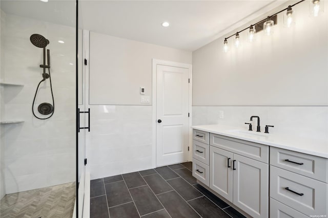 bathroom featuring vanity and a shower with shower door