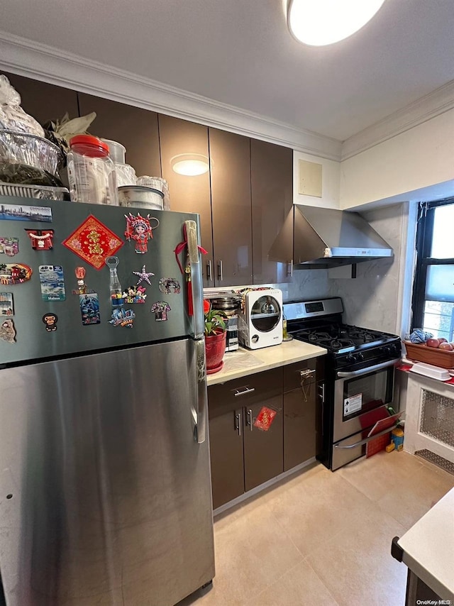 kitchen with ornamental molding, stainless steel appliances, and wall chimney exhaust hood