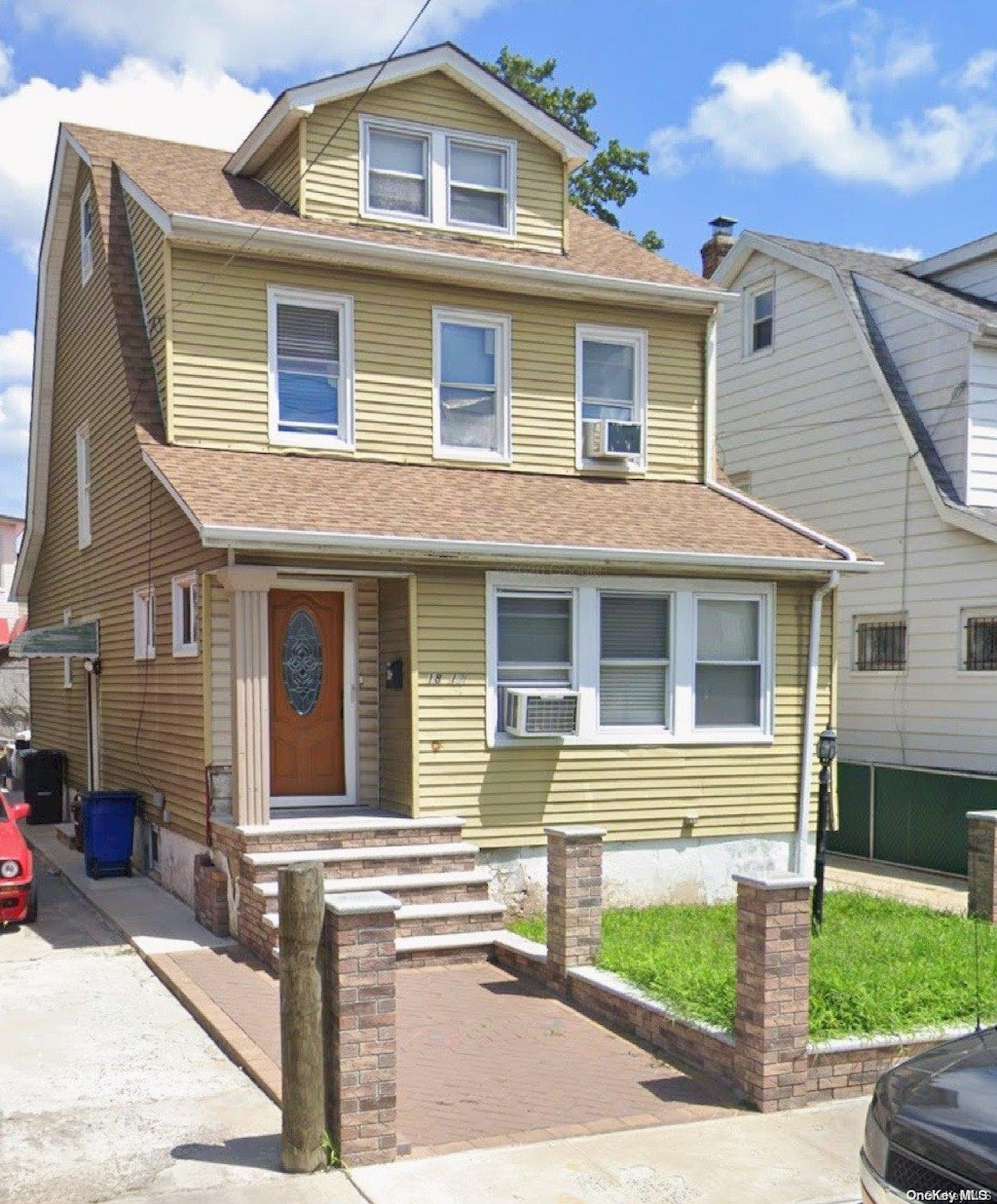 view of front facade with cooling unit