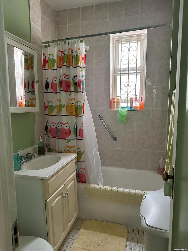 full bathroom with tile patterned floors, vanity, shower / bath combo, and toilet