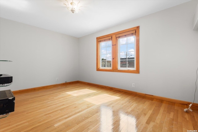 unfurnished room featuring light hardwood / wood-style flooring