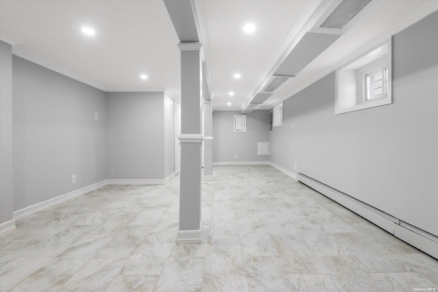 basement featuring crown molding and a baseboard radiator