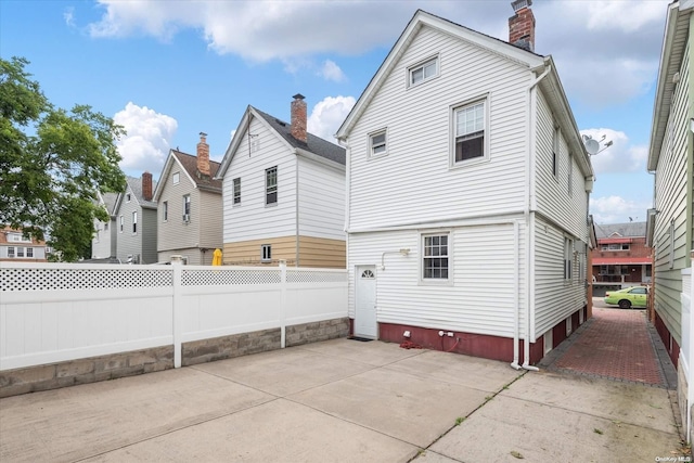 rear view of property with a patio area