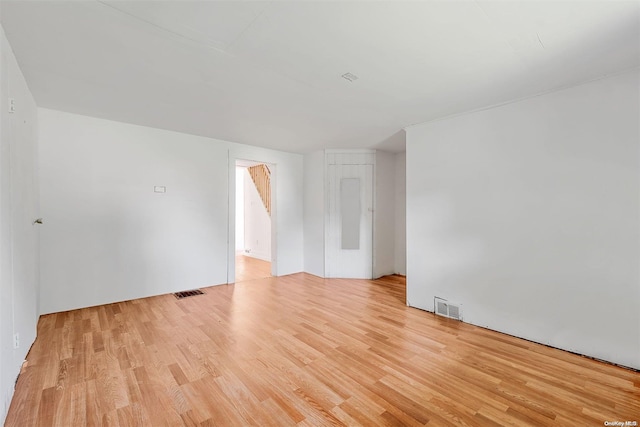 spare room with light hardwood / wood-style floors