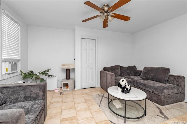 living room featuring ceiling fan and cooling unit