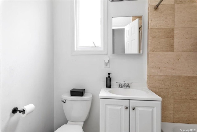 bathroom featuring vanity and toilet