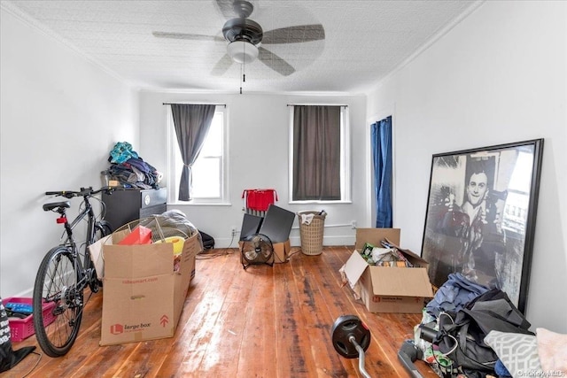 miscellaneous room with ceiling fan, light hardwood / wood-style floors, and a textured ceiling