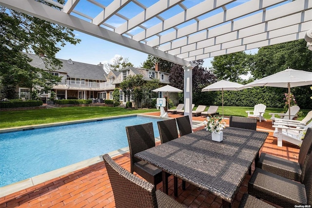 view of swimming pool featuring a lawn, a pergola, and a patio