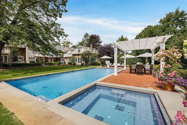 view of swimming pool with an in ground hot tub, a yard, a pergola, and a patio area