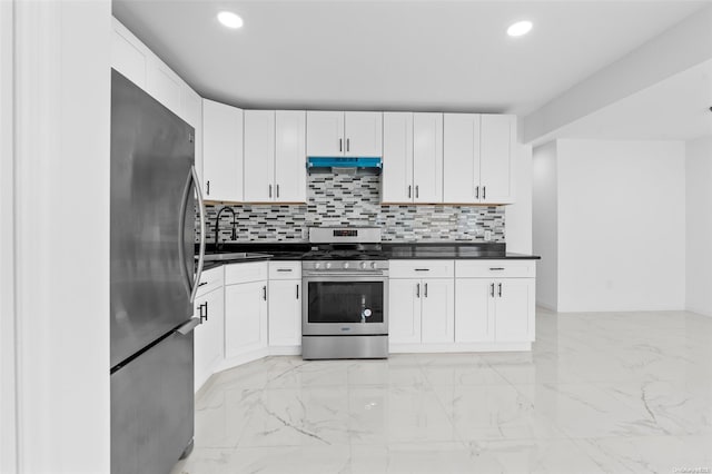 kitchen with decorative backsplash, white cabinetry, sink, and appliances with stainless steel finishes