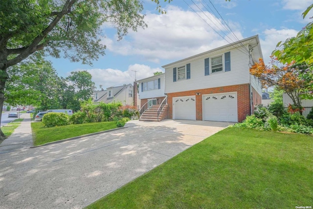 view of front of house with a front lawn and a garage