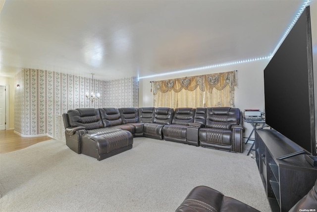 carpeted home theater with a chandelier