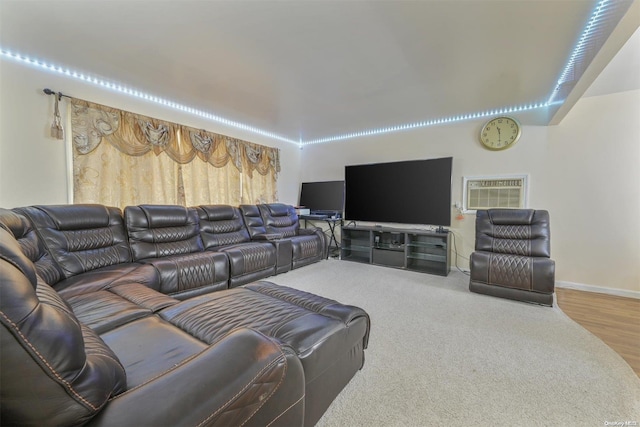 living room with hardwood / wood-style flooring and a wall unit AC