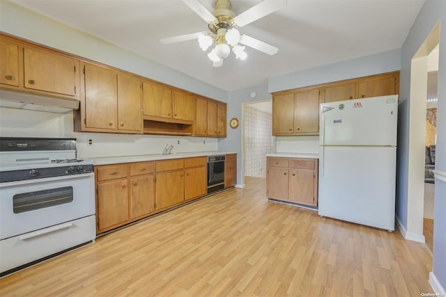 kitchen with white appliances, light hardwood / wood-style floors, ceiling fan, and sink