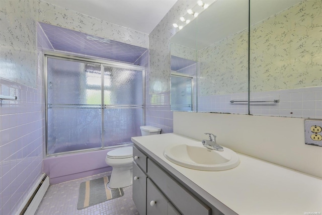 full bathroom featuring tile patterned floors, a baseboard radiator, tile walls, enclosed tub / shower combo, and toilet