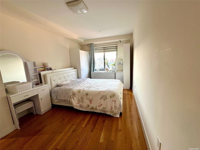 bedroom featuring dark hardwood / wood-style floors