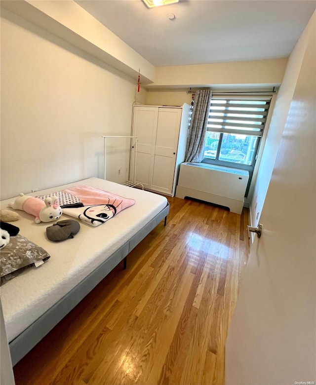 unfurnished bedroom with light wood-type flooring