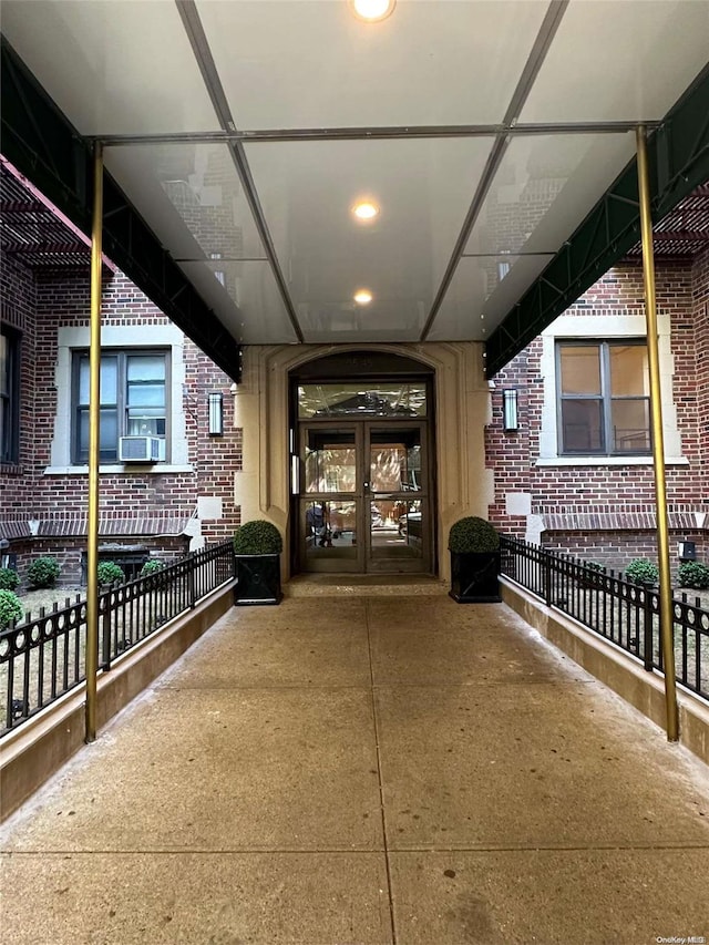 entrance to property with cooling unit and french doors