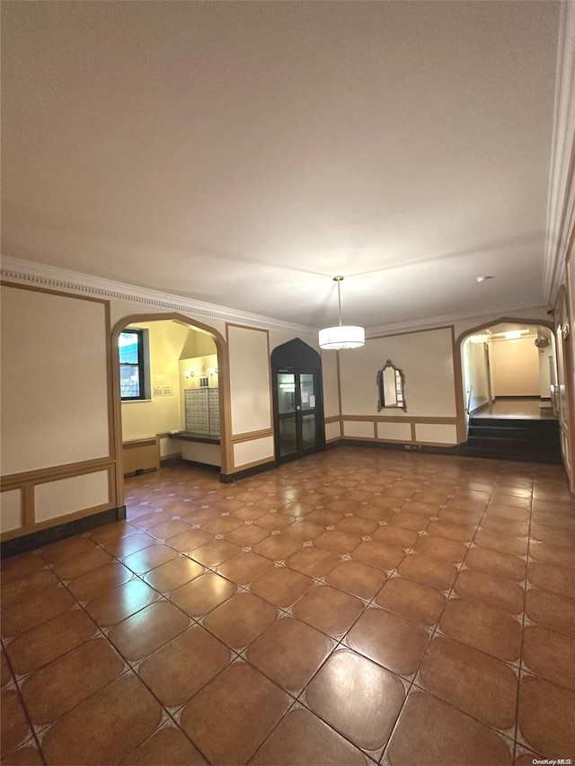 empty room featuring ornamental molding