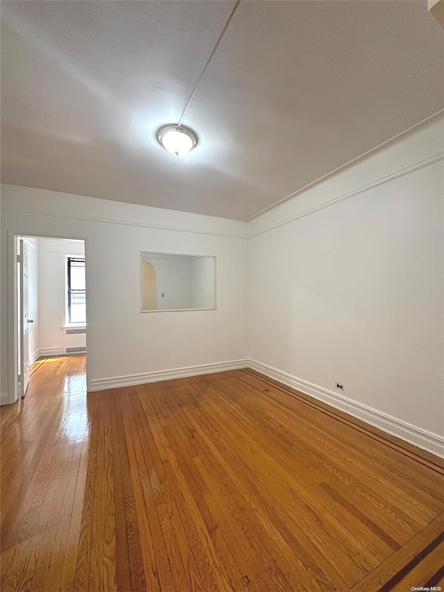 unfurnished room featuring wood-type flooring