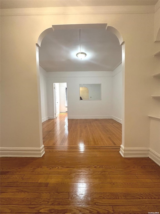 unfurnished room featuring hardwood / wood-style flooring