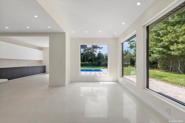 unfurnished living room with light tile patterned floors