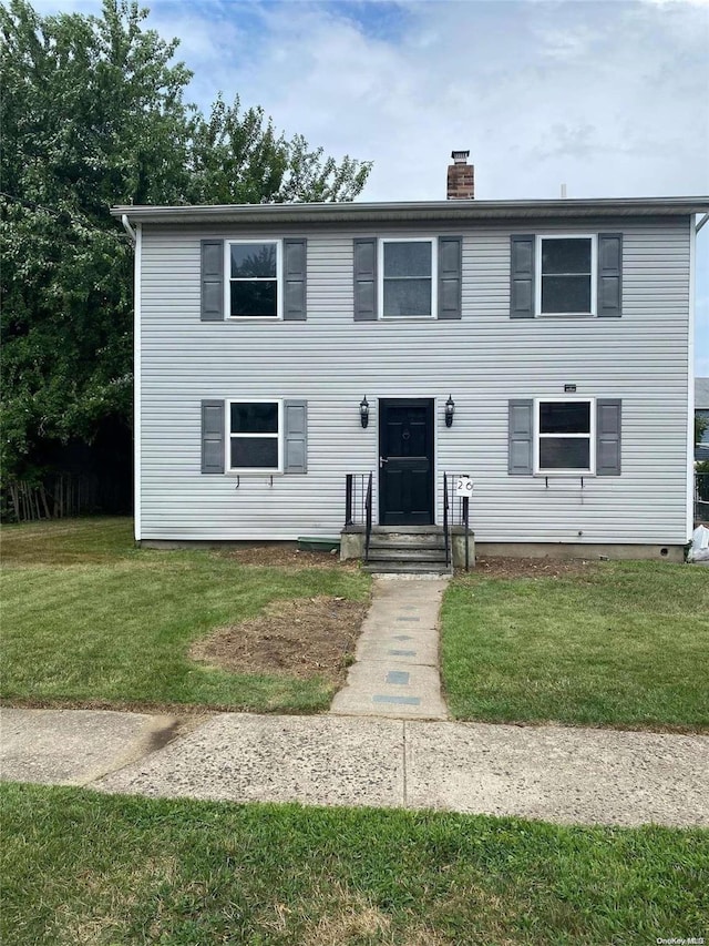 view of front of house with a front lawn