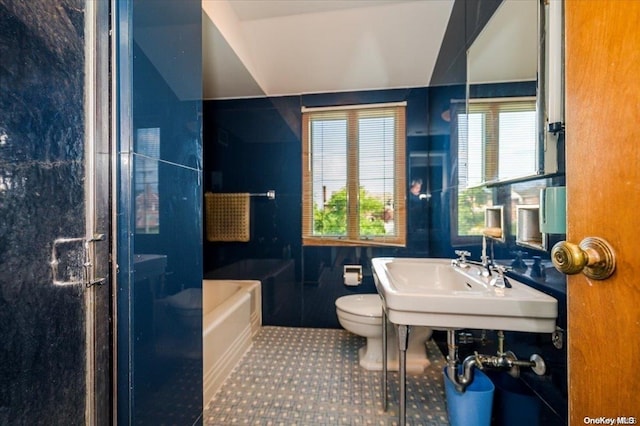 full bathroom with tile patterned floors, sink, tile walls, shower with separate bathtub, and toilet