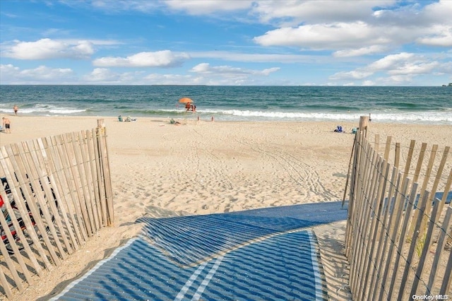 view of water feature with a beach view