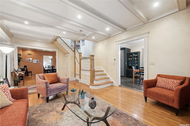 living room featuring hardwood / wood-style floors and beamed ceiling