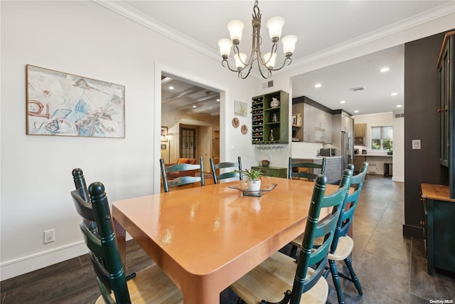 dining space with dark hardwood / wood-style flooring, ornamental molding, and an inviting chandelier