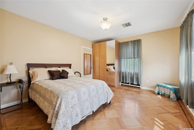 bedroom featuring light parquet floors