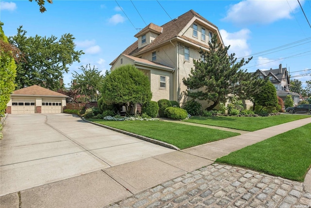 view of front of home with a garage, an outdoor structure, and a front lawn