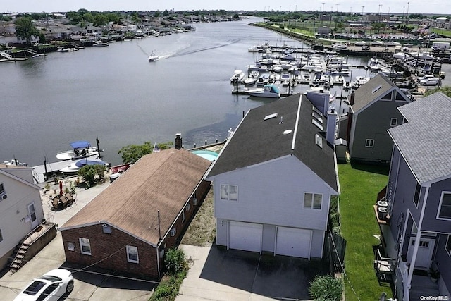 birds eye view of property featuring a water view