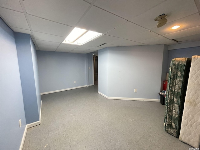 basement featuring a drop ceiling