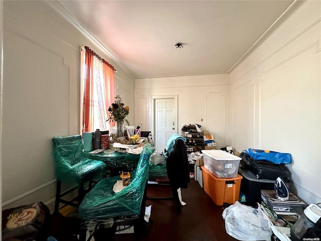 misc room featuring crown molding and dark wood-type flooring