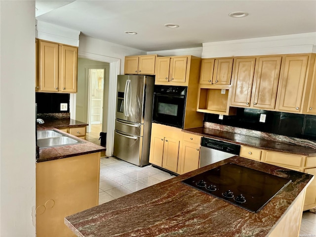 kitchen featuring light brown cabinetry, backsplash, sink, black appliances, and light tile patterned floors