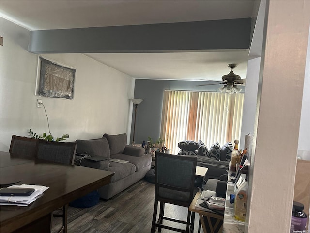 living room featuring dark hardwood / wood-style floors and ceiling fan