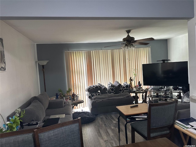 living room featuring hardwood / wood-style floors and ceiling fan