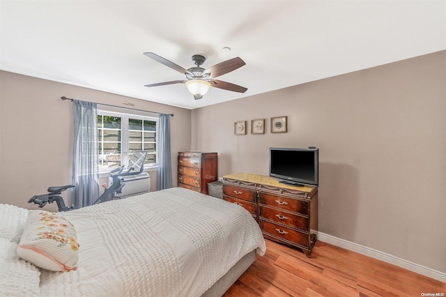 bedroom with ceiling fan and light wood-type flooring