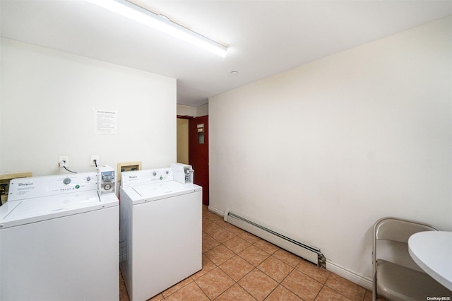 laundry room with baseboard heating, light tile patterned flooring, and separate washer and dryer