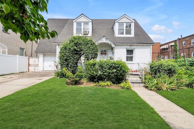 cape cod-style house featuring a front lawn