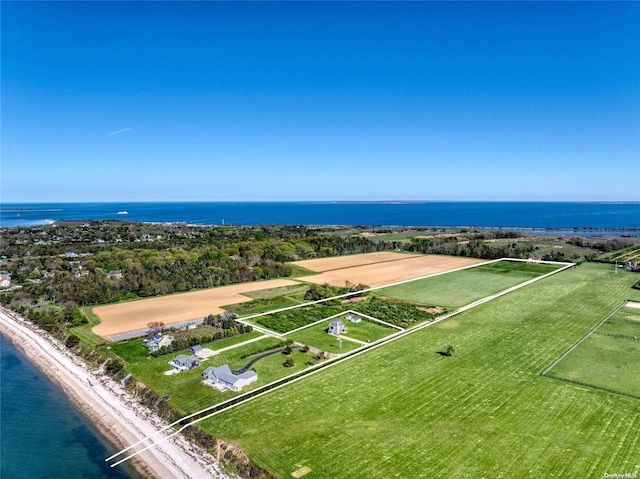 aerial view with a water view and a beach view