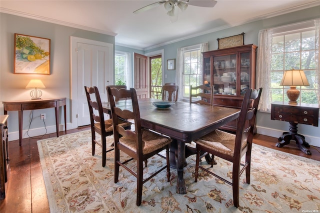 dining area with ceiling fan, ornamental molding, and hardwood / wood-style flooring