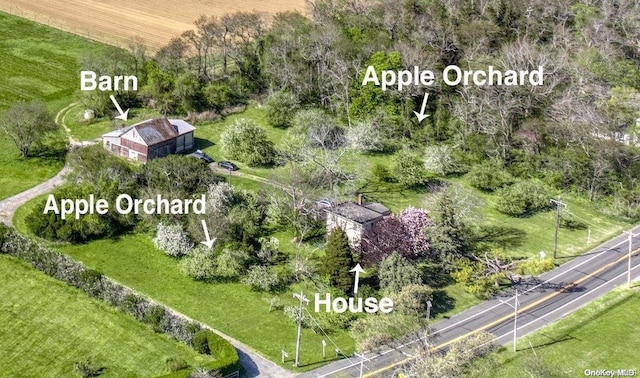 birds eye view of property with a rural view