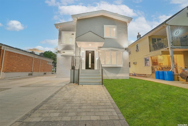 view of front of house with a front lawn