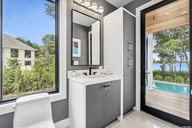 bathroom with vanity and toilet