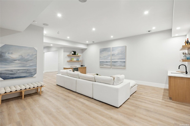 living room with light hardwood / wood-style flooring